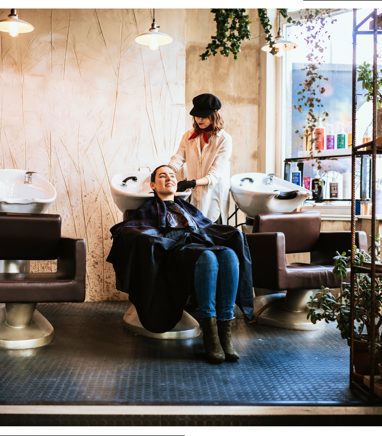 Woman enjoying hair wash at salon